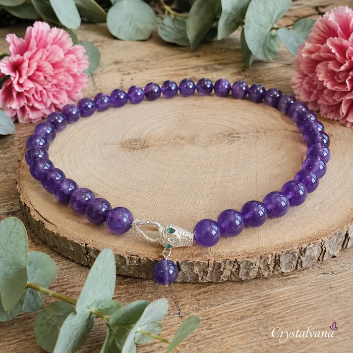 Amethyst necklace on display with natural lighting - purple crystal pendant for meditation