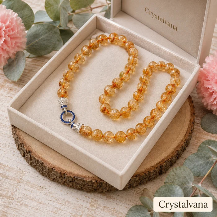 Citrine necklace on display with natural lighting - yellow crystal pendant for prosperity