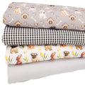 A fat quarter bundle of fabrics featuring dogs and checks