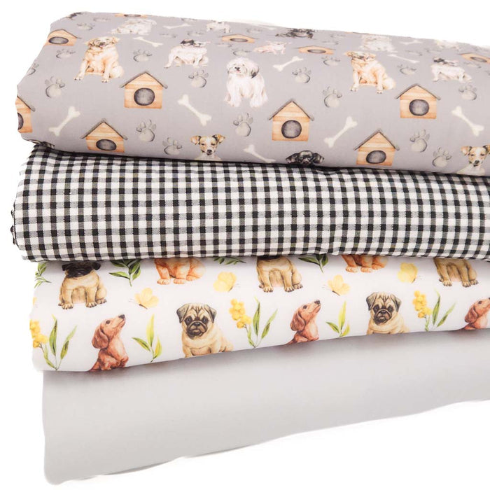 A fat quarter bundle of fabrics featuring dogs and checks