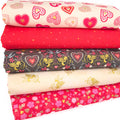 A fat quarter bundle of five love themed prints by Lewis & Irene