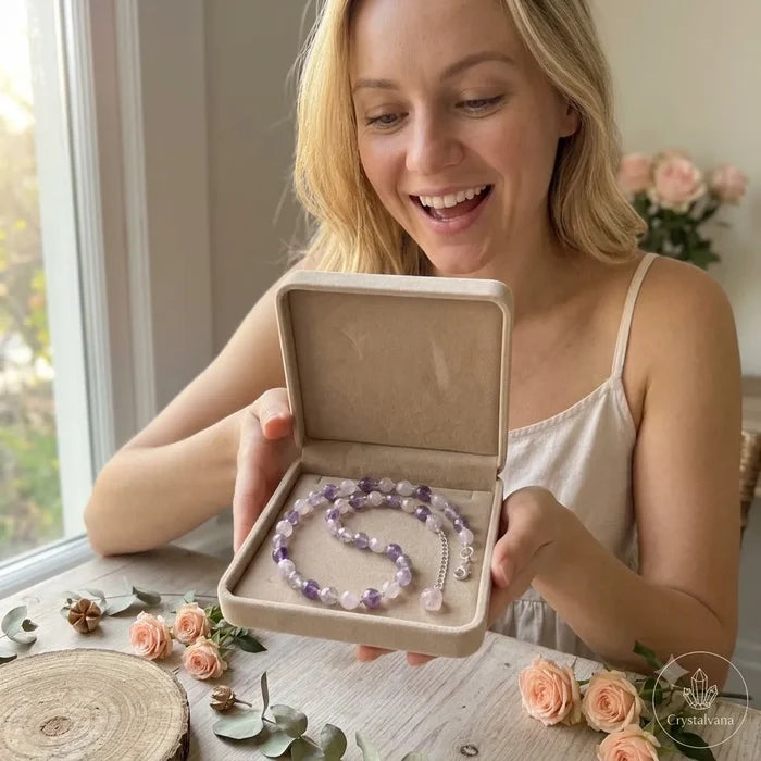 Woman presenting amethyst crystal choker in gift box with smile, perfect gift idea, Crystalvana