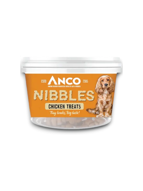 Stock image of the Anco Nibbles Chicken Treats, showing the packaging pot with a yellow label and a dog on the front.