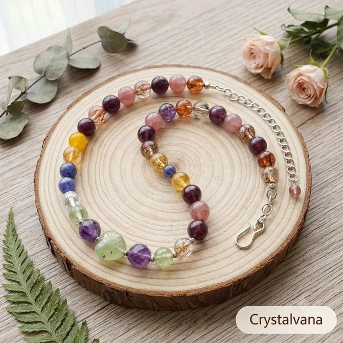 Black Gold Super Seven multi-gemstone necklace on wood display showing natural bead texture, Crystalvana