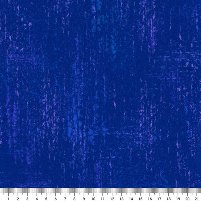 Textured blue An indigo textured cotton quilting fabric with a ruler at the bottom for scale