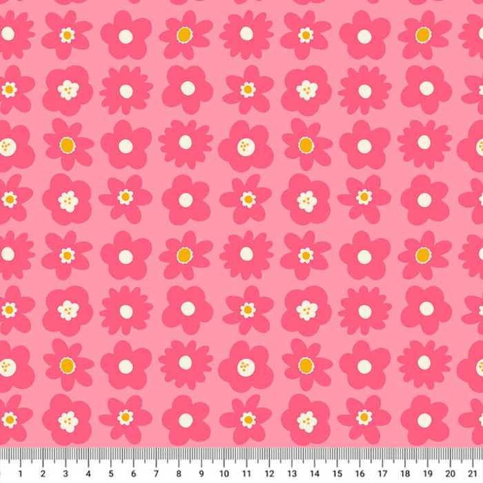 Pink flowers printed on a cotton quilting fabric with a cm ruler