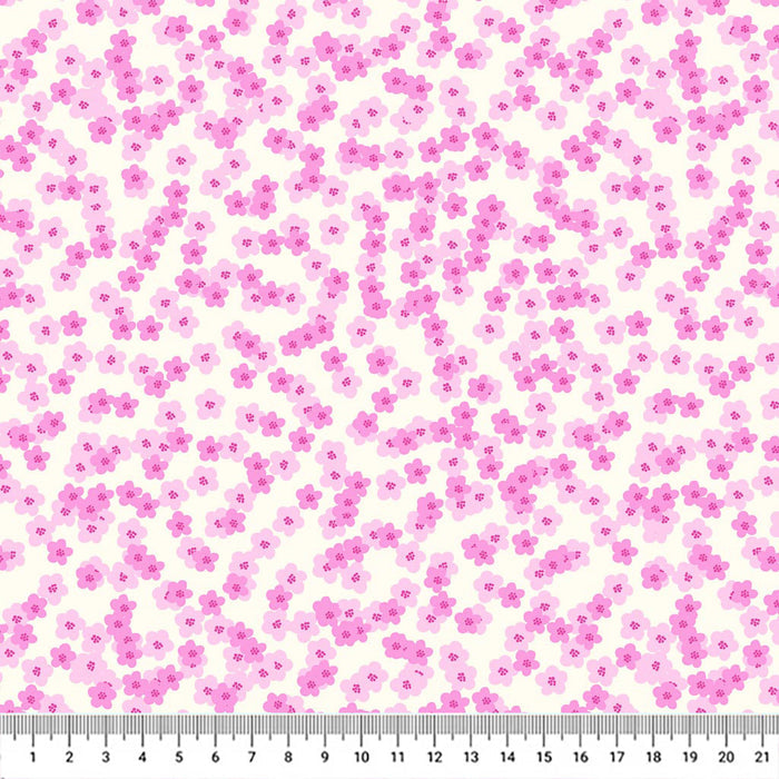 Pretty pink shaded blossoms scattered across a white 100% cotton fabric with a cm ruler