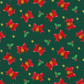 Pattern of red bows, holly leaves, and berries on a green background