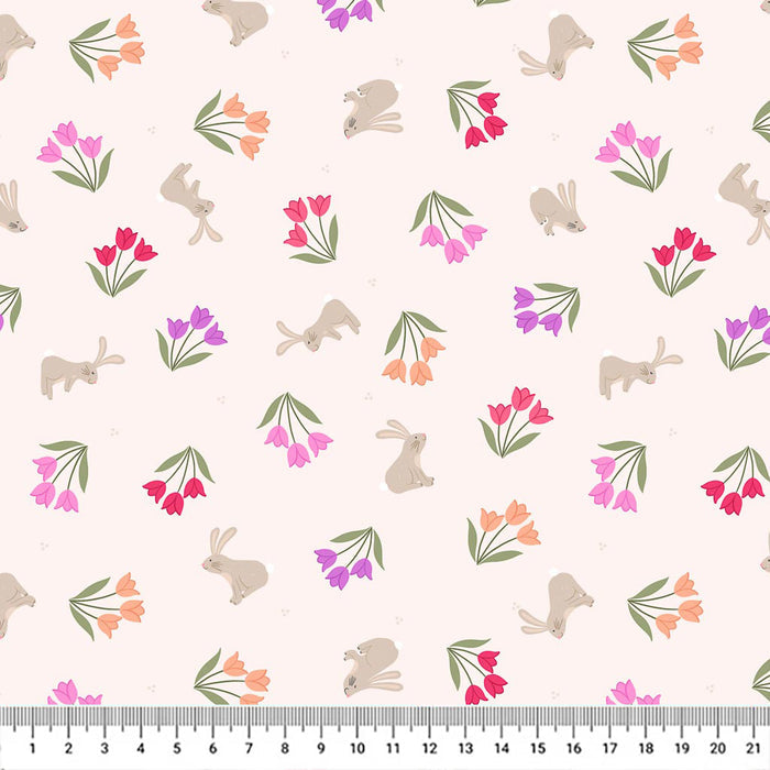 Tulip bunches in pinks and purples scattered around grey bunnies on a cream 100% cotton fabric with a cm ruler