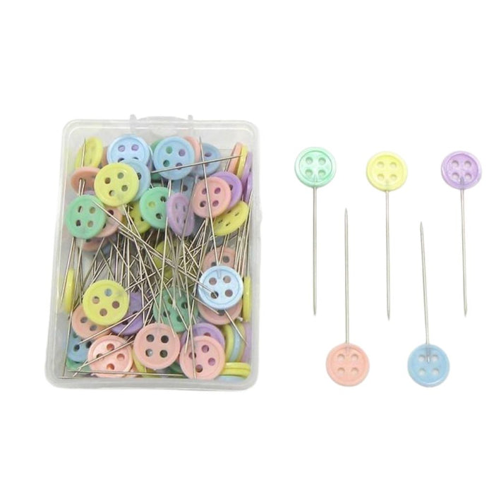 Set of colorful button pins with a clear container on a white background