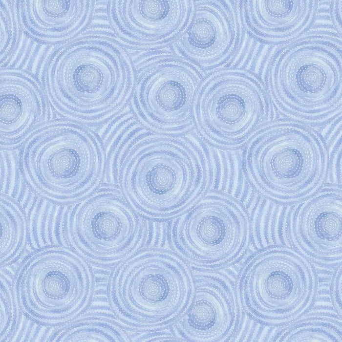 Pattern of concentric circles on a light blue quilting fabric