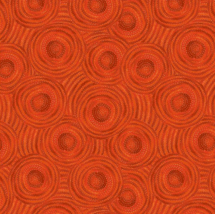 Red textured patterned quilting fabric with circular designs