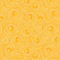 Pattern of concentric circles on a yellow quilting fabric