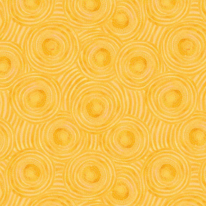 Pattern of concentric circles on a yellow quilting fabric