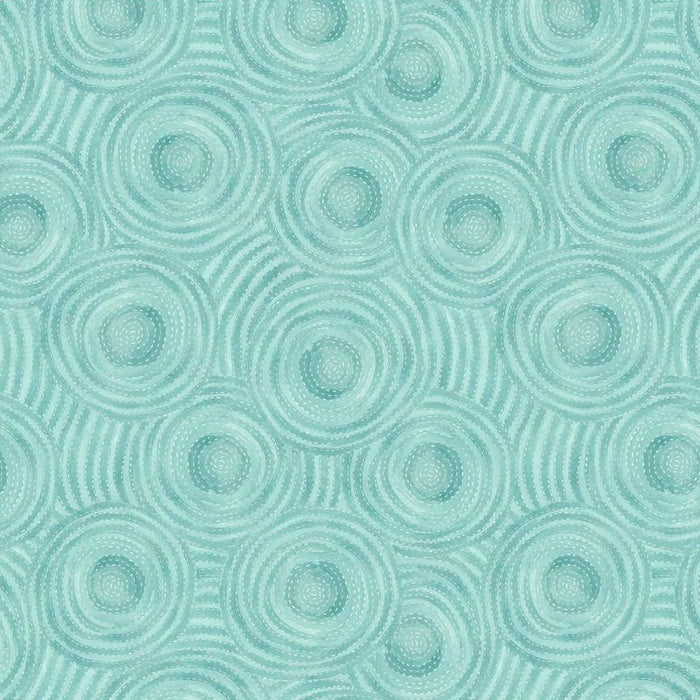 Pattern of concentric circles on a teal quilting fabric