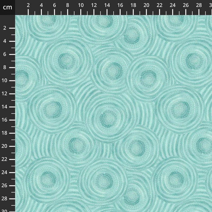 Teal quilting fabric with circular pattern and measurement scale on the side