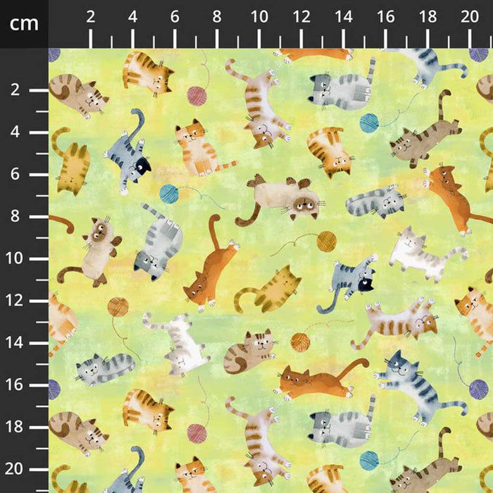 Fabric with cartoon cats pattern on a yellow quilting fabric, measured in centimeters.