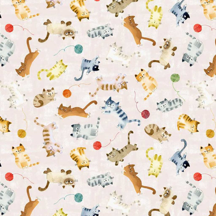 Pattern of cartoon cats and yarn balls on a light quilting fabric