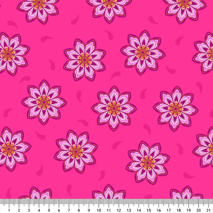 Floral pattern with pink and purple flowers on a bright pink cotton quilting fabric, ruler at the bottom for scale.