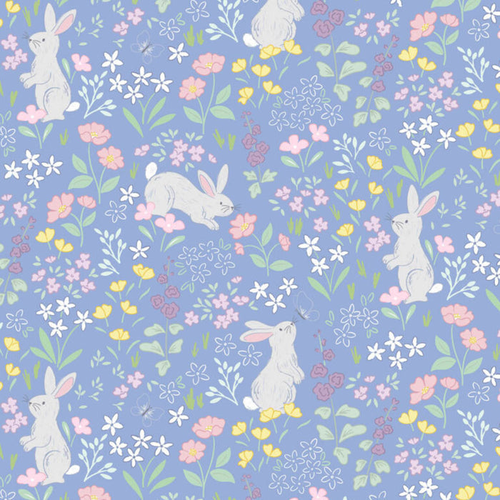 Bunnies printed on a cornflower blue cotton quilting fabric