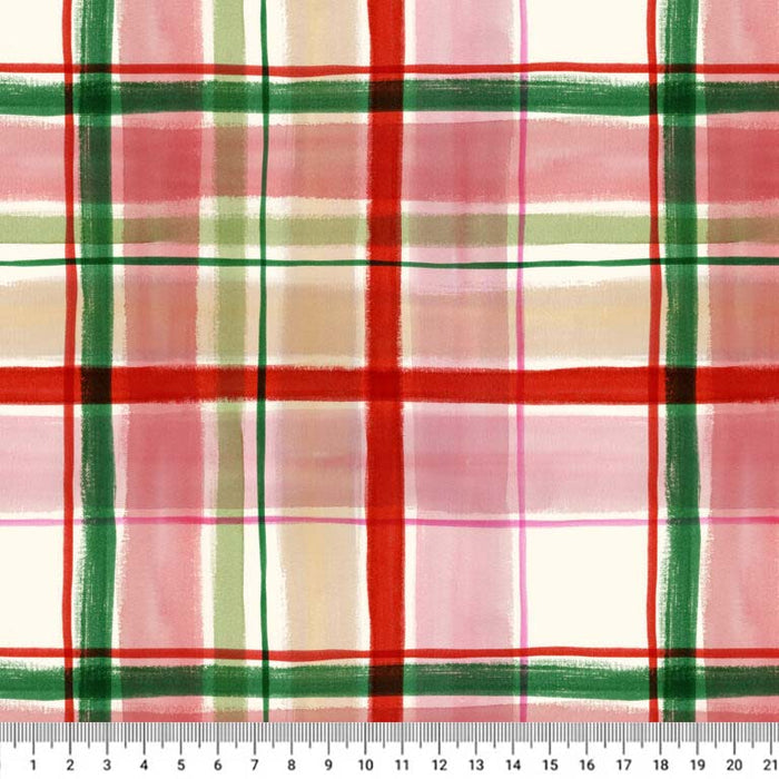 A close-up of a plaid fabric pattern with red, green, pink, and beige stripes on a white cotton quilting fabric, with a ruler at the bottom showing measurement scale.