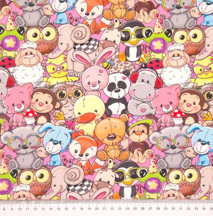 Crazy animals printed on a pink cotton french terry fabric with a cm ruler
