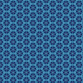 A geometric pattern in bright blues printed on a cotton quilting fabric