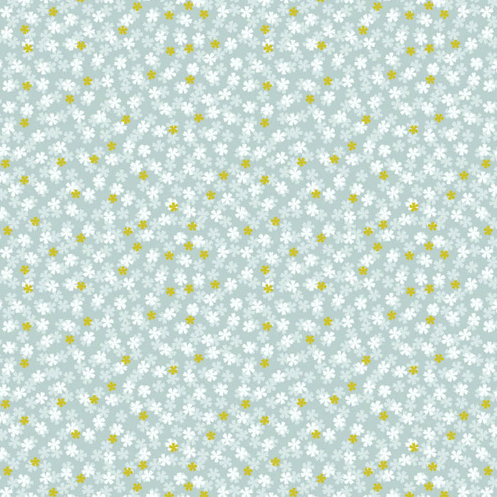 Pattern of small white flowers and yellow dots on a light blue cotton quilting fabric