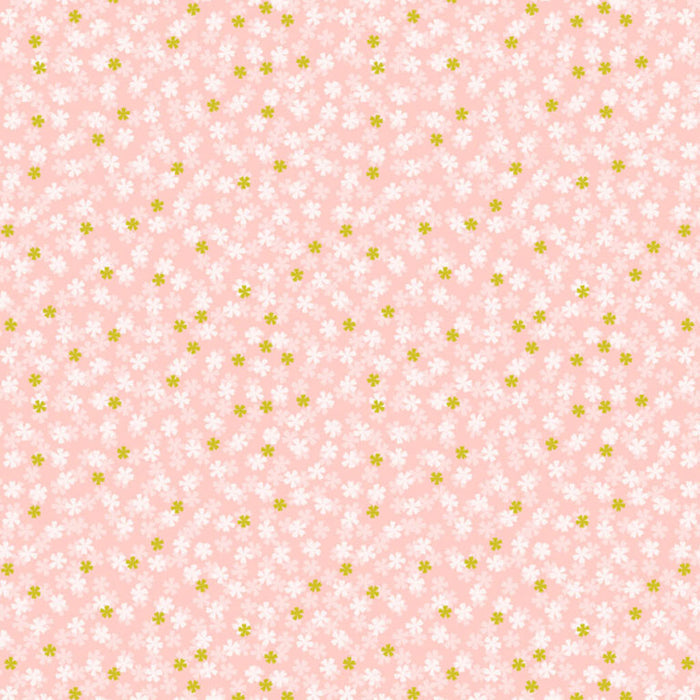 Pattern of small white flowers with green centers on a pink cotton quilting fabric