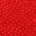 Red cotton quilting fabric with small white polka dots