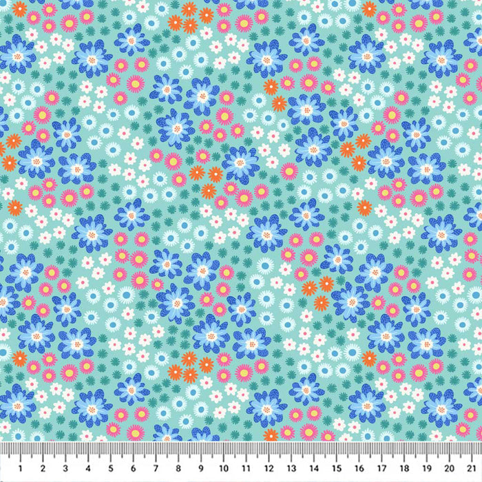 Blue flowers printed on a turquoise quilting cotton fabric with a cm ruler