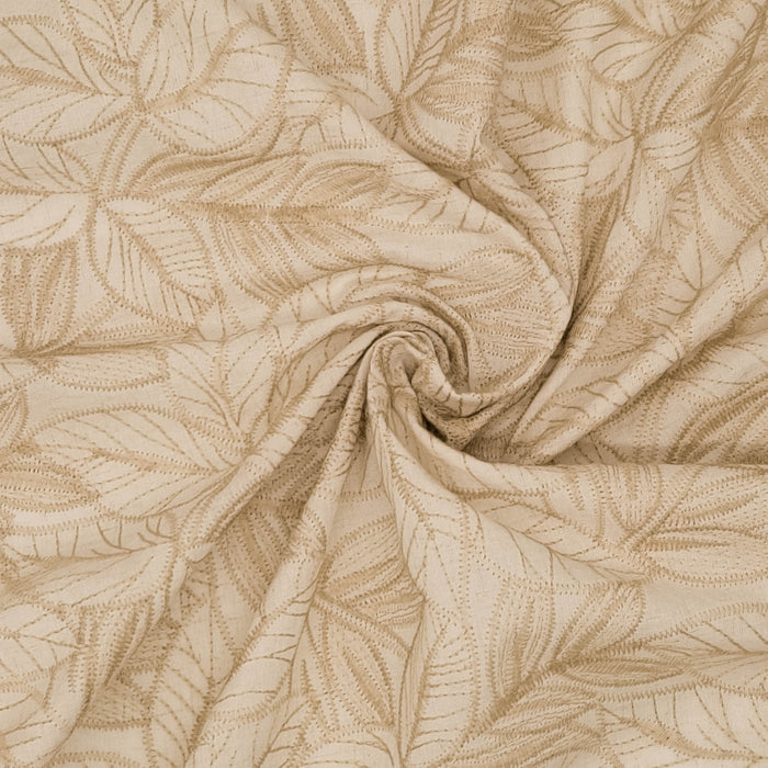 Textured beige fabric with leaf pattern