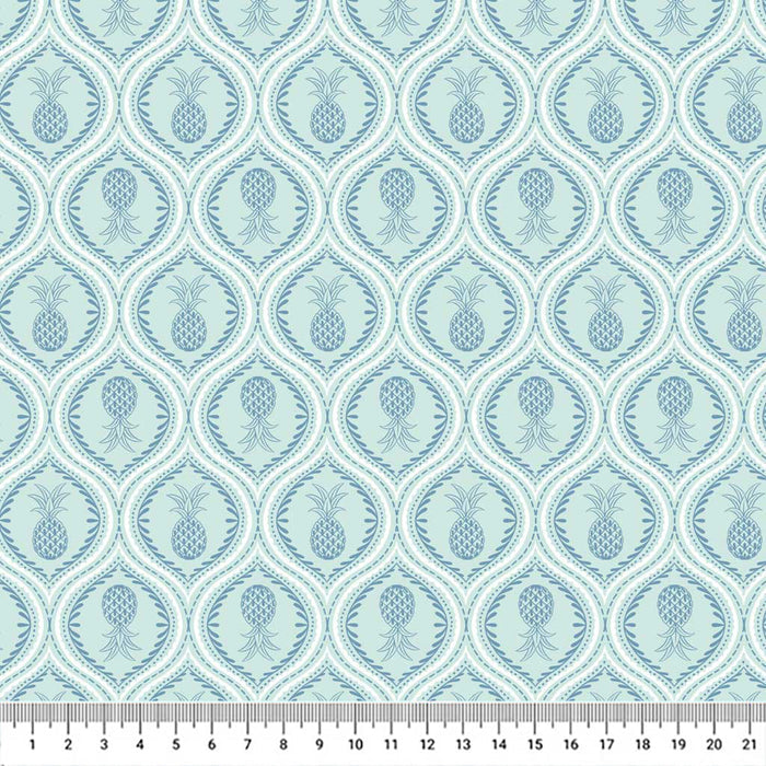Gorgeous pineapples in mandala-like tear drops of navy are printed on a light lagoon blue quilting cotton.