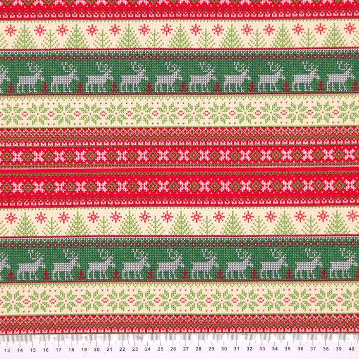 A striped scandinavian style christmas cotton jersey fabric with a cm ruler