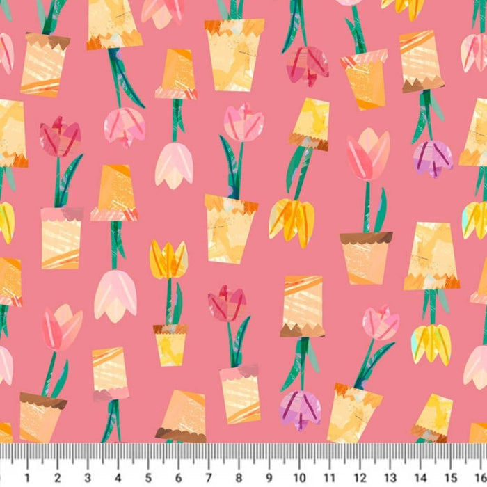 Pattern of potted flowers on a pink cotton quilting fabric with a ruler at the bottom.