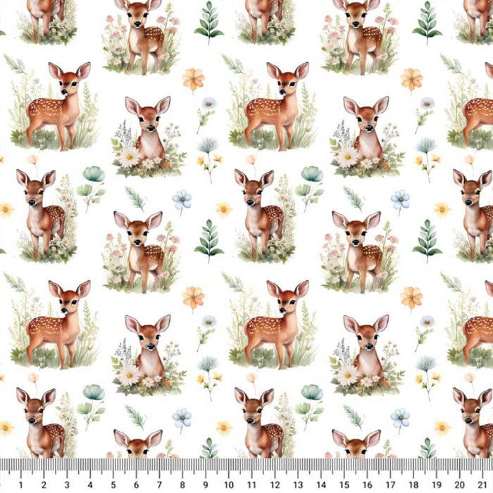 Pattern of deer and flowers on a white polycotton fabric with a ruler at the bottom.