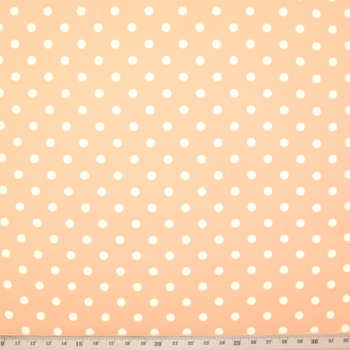 Peach pastel pea spot polycotton fabric