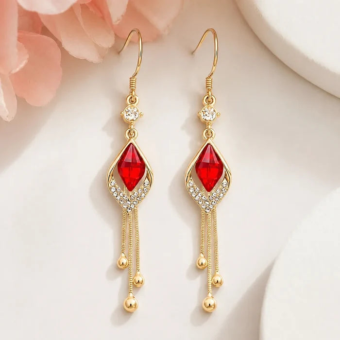 French design red crystal cat's eye drop earrings flat lay on beige velvet box, Crystalvana