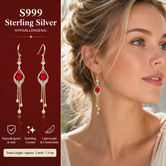 Model wearing French design red crystal cat's eye drop earrings blonde low bun ear close-up, Crystalvana