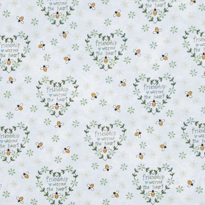A repeating pattern on a white background featuring green leaf wreaths with the phrase 'Friendship warms the heart,' small yellow-and-black bees, and tiny white flowers.