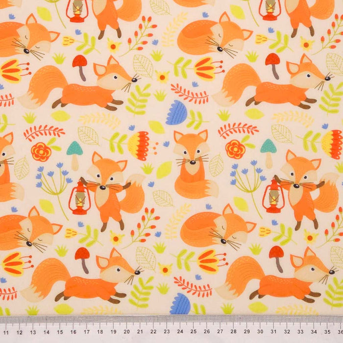 Foxes printed on a cream polycotton fabric with a cm ruler