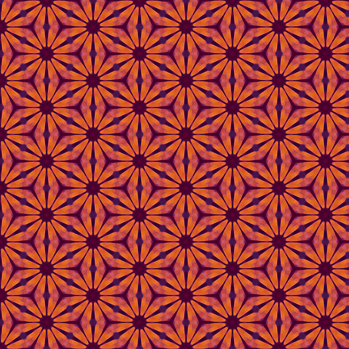 A floral geometric pattern in reds and oranges printed on a cotton quilting fabric