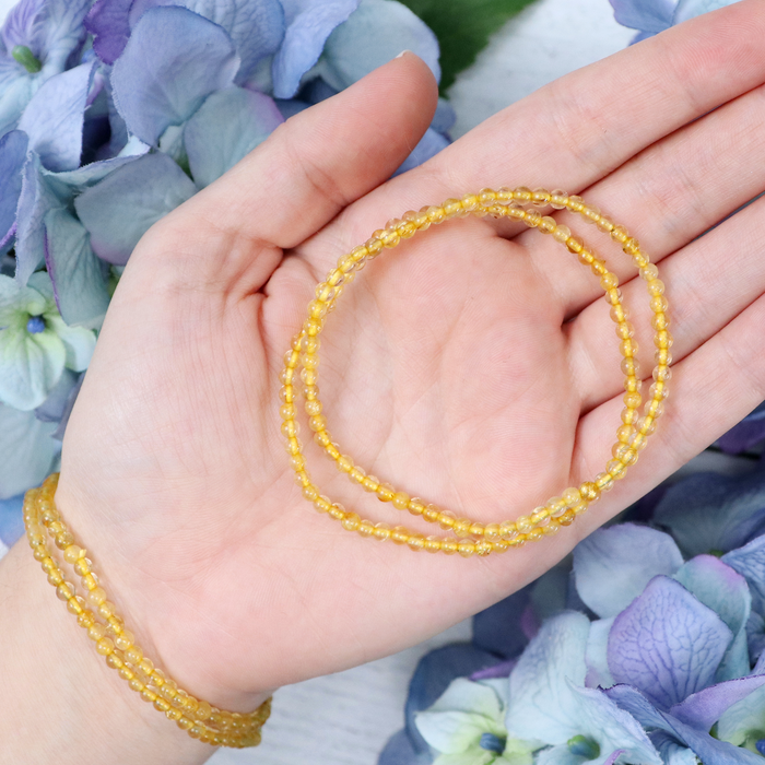 Gold Rutilated Quartz bracelet worn on the wrist