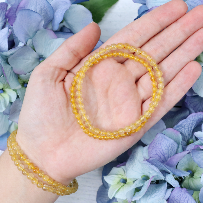 Gold Rutilated Quartz beaded bracelet in Crystalvana gift packaging