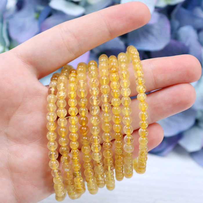 Side view of the Gold Rutilated Quartz stretch bracelet
