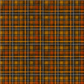 A close-up of a plaid fabric pattern with intersecting orange, yellow, black, and gray stripes forming a tartan design.