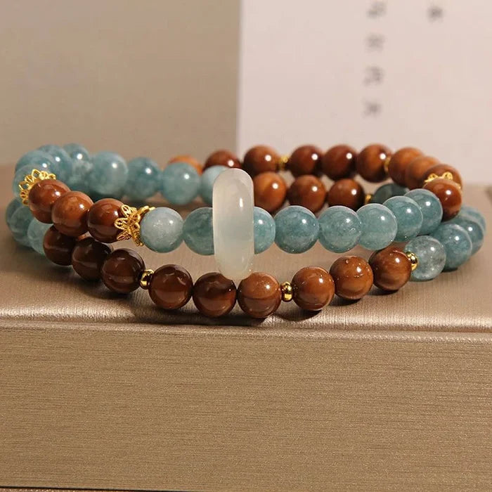 Handcrafted chalcedony jade bracelet on wrist - calm communication jewelry