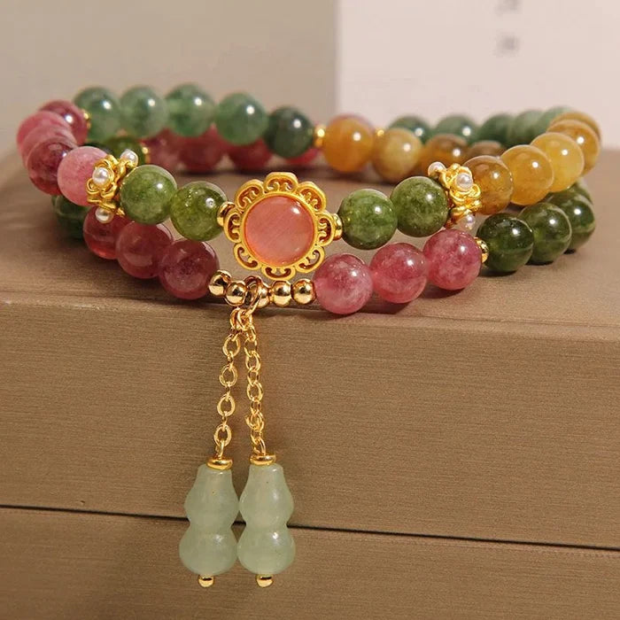 Tourmaline beads with gourd charm - detail one