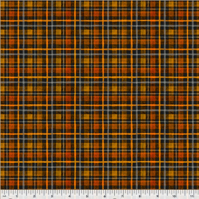 A close-up of a plaid fabric pattern with orange, black, gray, and yellow stripes, shown flat with a measurement ruler along the bottom edge.
