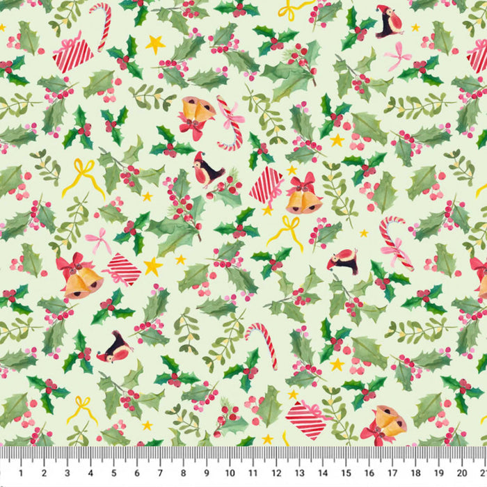 A repeating Christmas-themed pattern on a pale cream background, featuring green holly leaves, red berries, candy canes, bells, bows, stars, and small red-and-white striped hearts. A ruler strip appears along the bottom edge for scale.